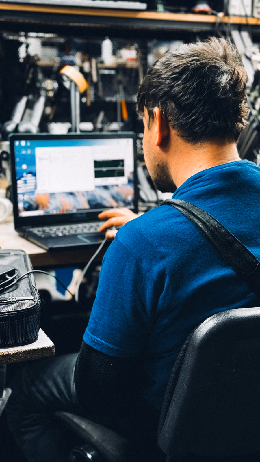 Technician working on laptop